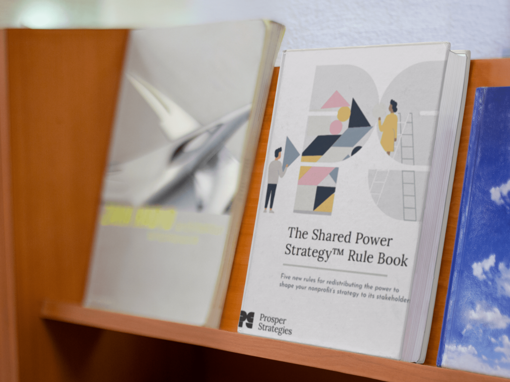 Shared Power Strategy Rule Book on a shelf