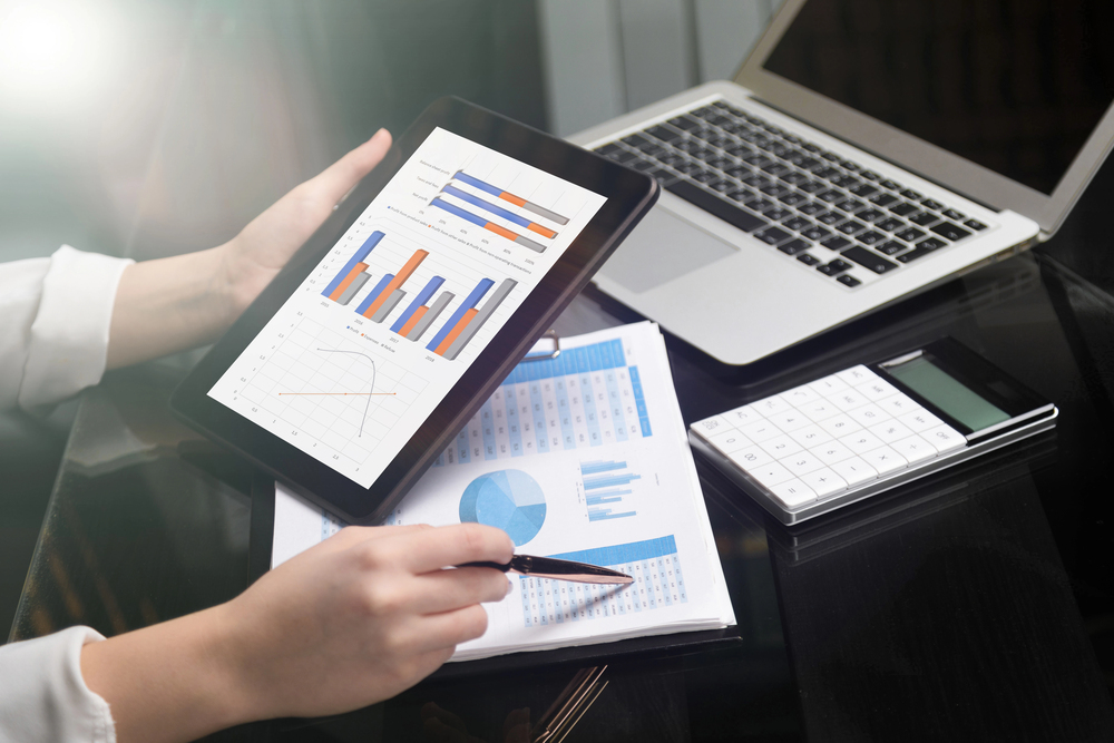 A nonprofit professional looking at fundraising data to determine the organization’s fundraising strengths